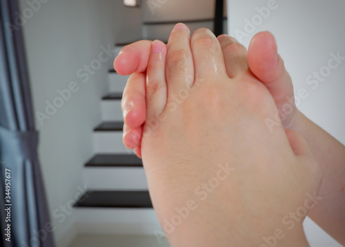 Women hands using wash or wipe hand sanitizer gel pump dispenser for protection coronavirus and bacteria, health care concept.anti virus by washing hands everytime after take out from home.Close up. photo