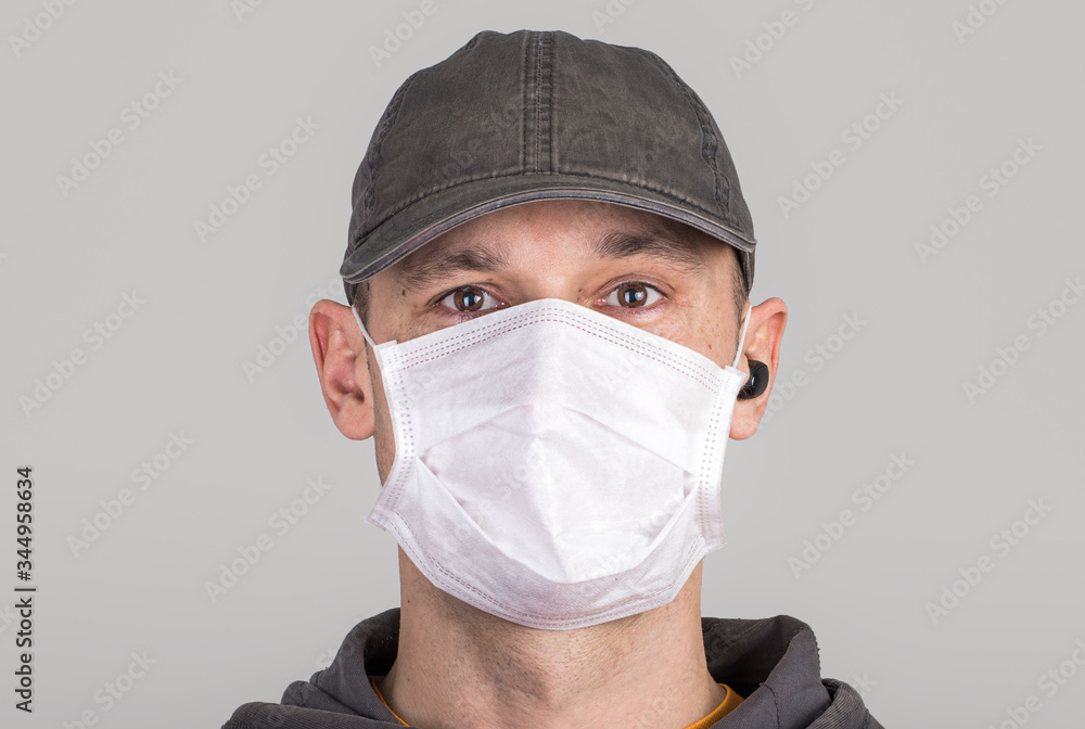 Frightenedman in a medical mask, opened eyes Frightenedman in a medical mask, opened eyes