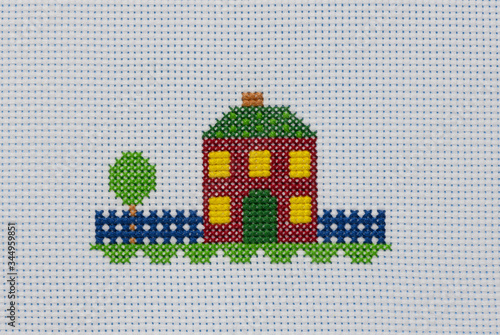 Obraz na plátne The cross-stitch colored house is in summer
