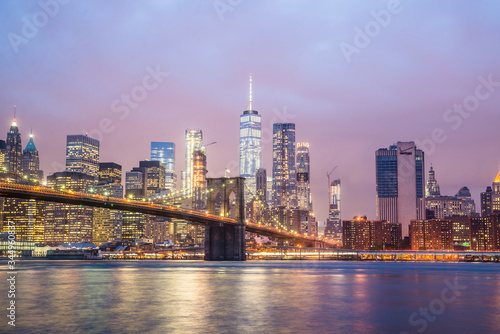 new york city skyline and brooklyn bridge at night © Zach