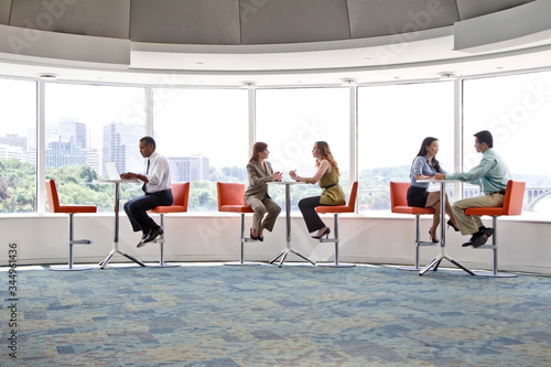 Business people working in office cafeteria