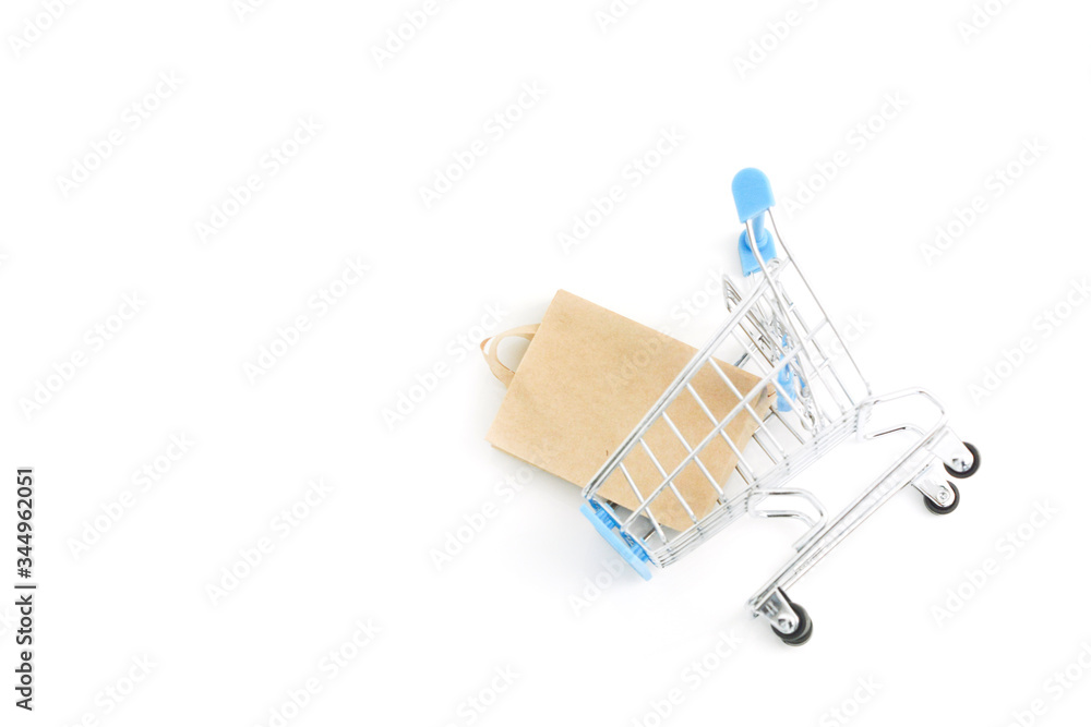 Small supermarket grocery push cart for shopping trendy fashion background. Sale buy mall market shop consumer concept