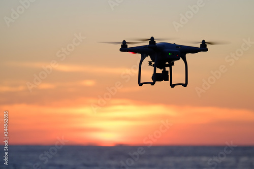 Drone quadcopter at sunset
