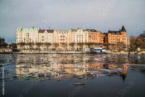Photography reflection of colorful houses on ice in stockholm sweden