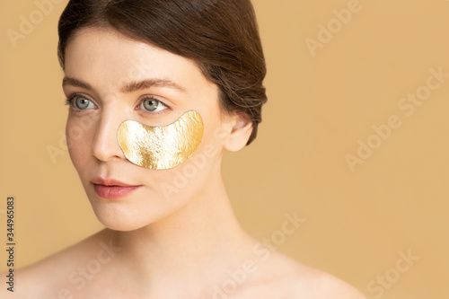 Woman Using Cosmetic Mask photo