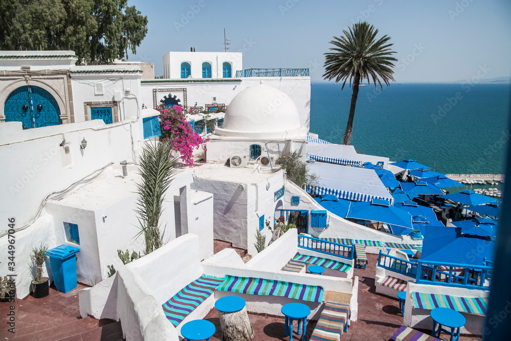 Fototapeta premium white village over looking the blue water of the mediterranean sea