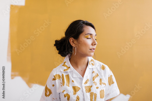 portrait of young woman with hand painted clothing