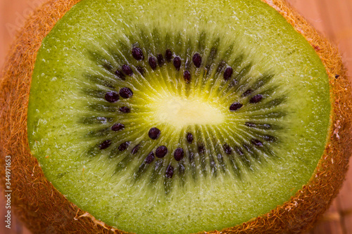 Kiwi fruit cutaway. Food macro shot.