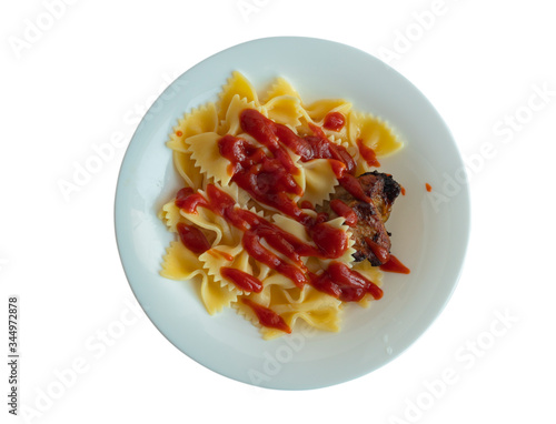 isolated on a white background. A white plate in it is a piece of pasta meat watered with ketchup