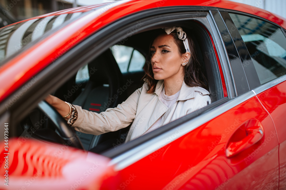 Attractive young caucasian woman driving a car Attractive young caucasian woman driving a car