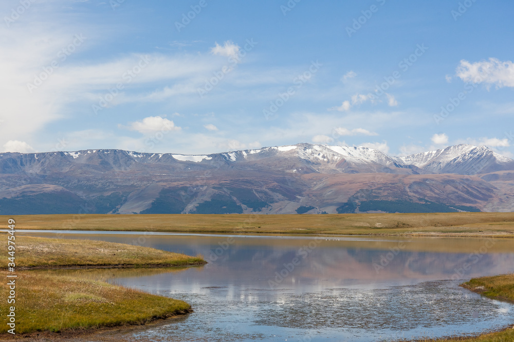 Typical view of Mongolian landscape. Altai, Mongolia. Beautiful mountain landscape, lake and mountain range