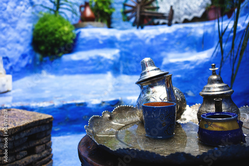 Close up of a traditional tea set in a rural morocan house in Chefchaouen, near the Rif Mountain, Morocco, Africa photo