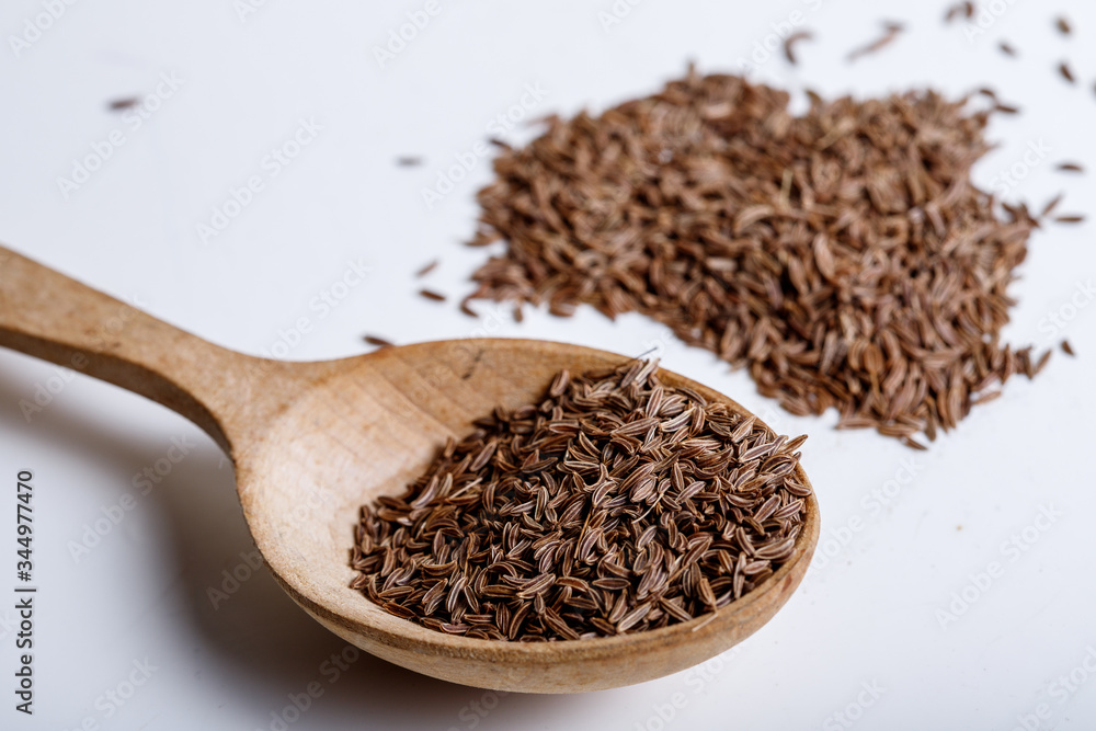 Pile of cumin seeds isolated on white background Pile of cumin seeds isolated on white background