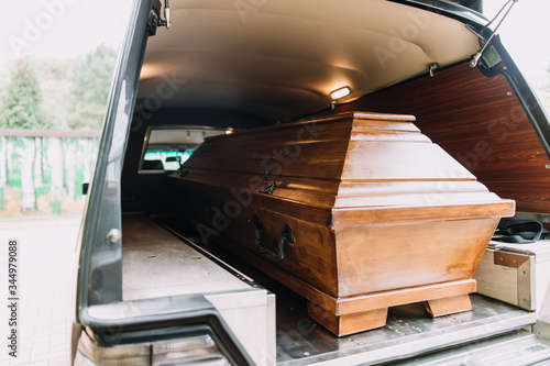 photo of a coffin in the back of car