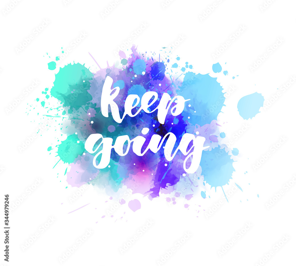 Keep going - handwritten modern calligraphy inspirational text on multicolored watercolor paint splash. Blue and purple colored background with abstract dots decoration.