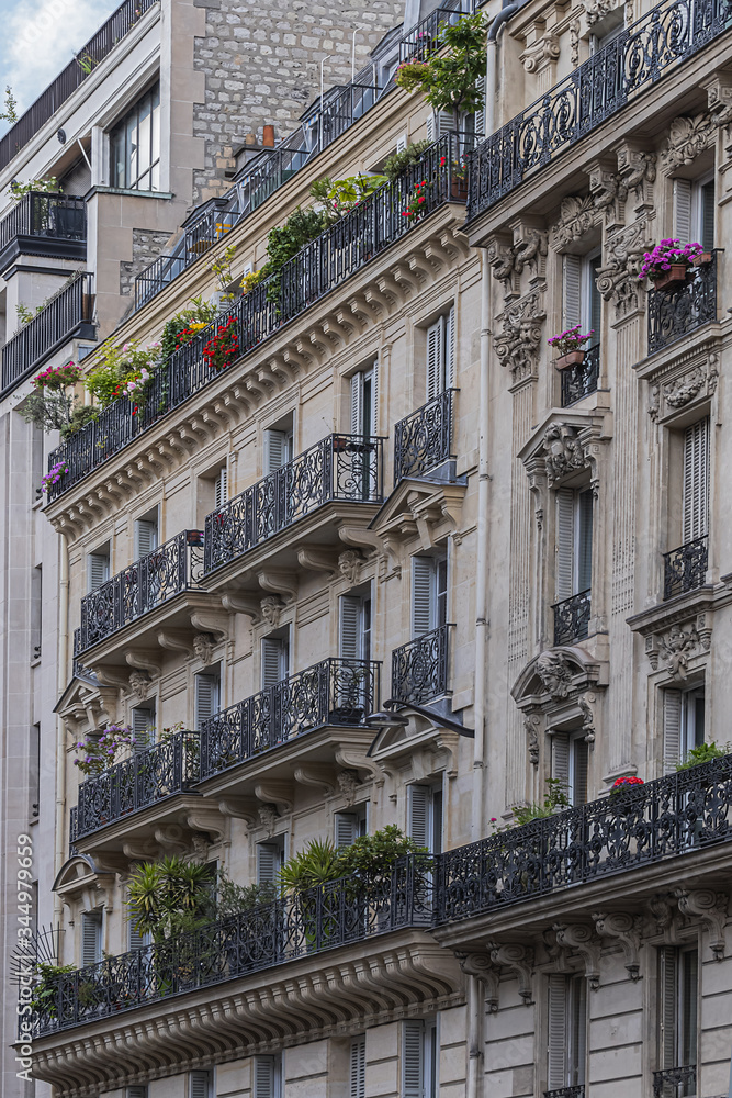 Fototapeta premium Old French house with traditional balconies and windows. Paris, France.