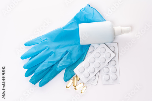 A set of tools to combat coronavirus, blisterase tablets, disposable mask, antiseptic, jar pills, vitamins