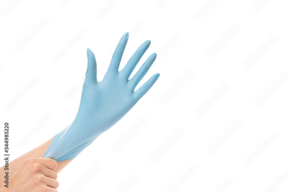 Obraz premium Woman wearing blue protective glove on her hand, isolated on white background