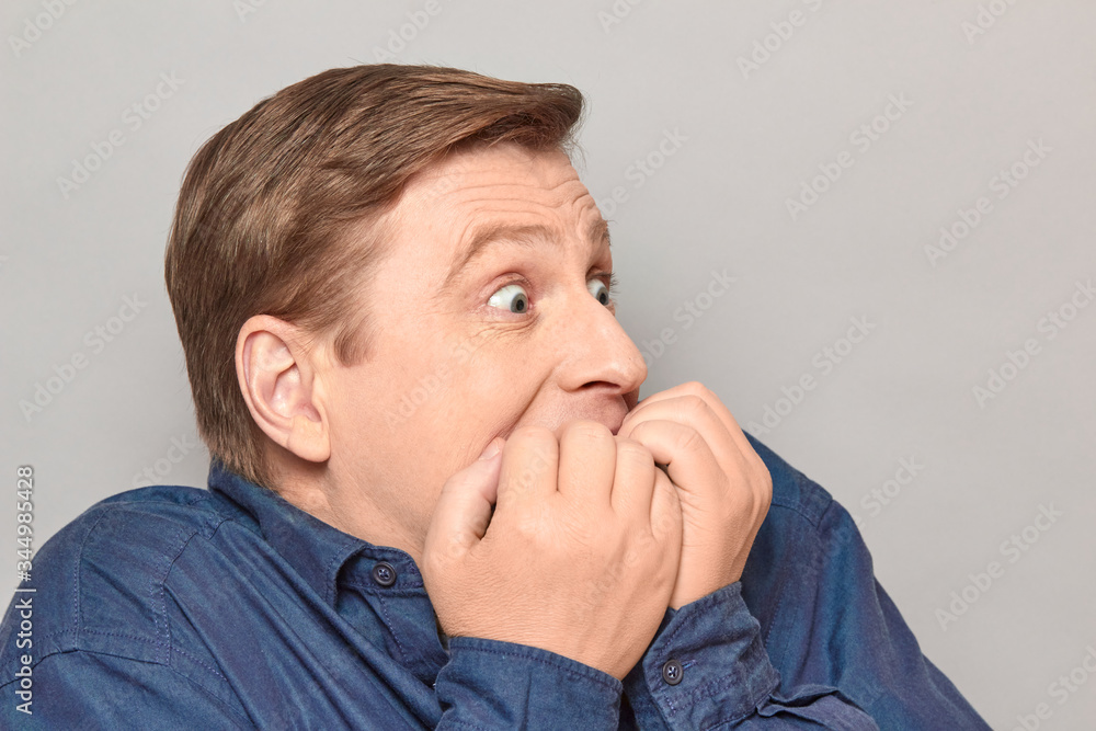 Portrait of shocked frightened man with eyes widened and full of fear Portrait of shocked frightened man with eyes widened and full of fear