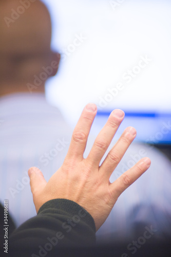 Hands gesturing making a point in business meeting