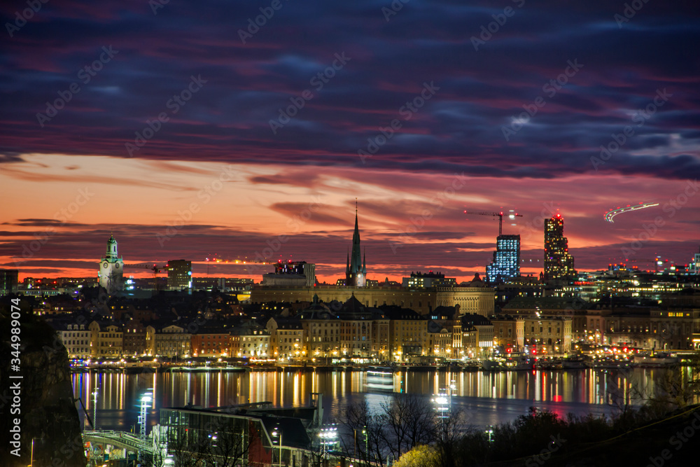 Obraz premium Scenic view of the Old Town (Gamla Stan) in Stockholm with a dramatic sunset, capital of Sweden