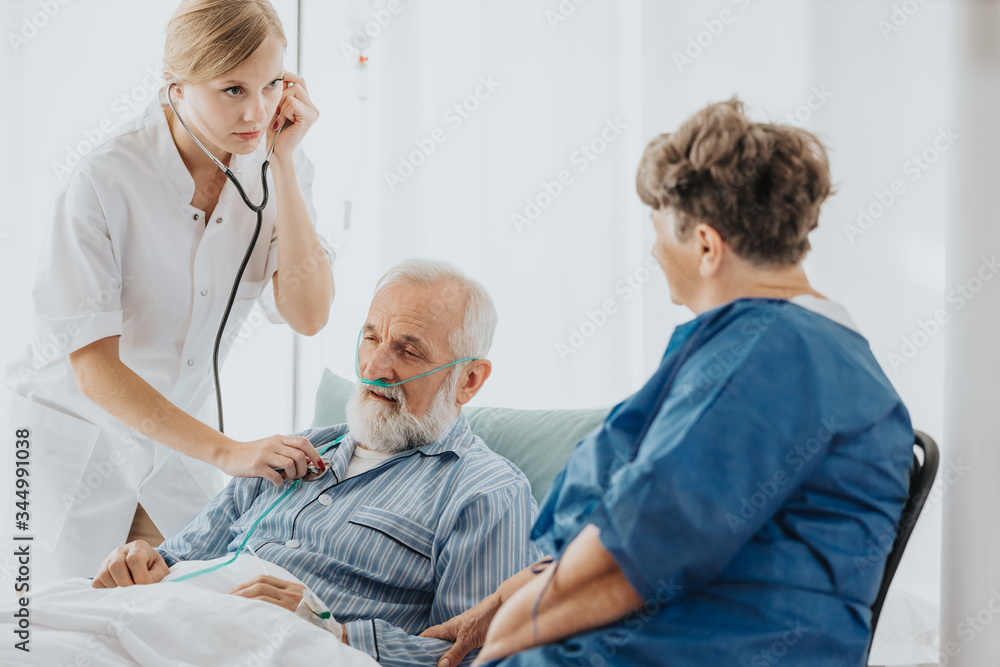 Fototapeta premium Auscultating the patient