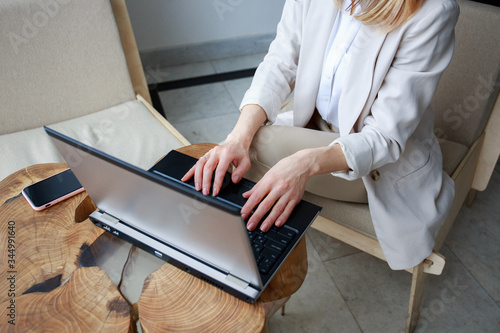 girl typing on the laptop keyboard