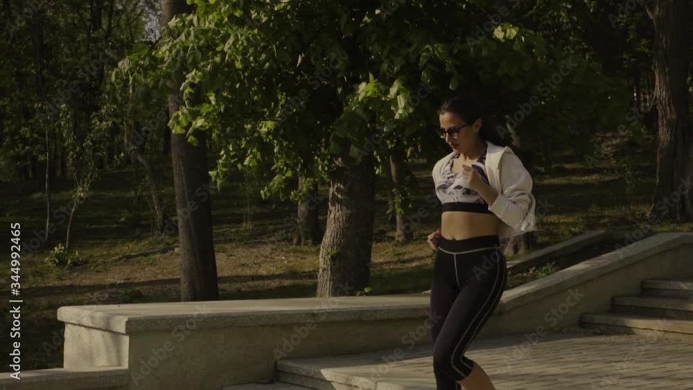 Young woman running in park Young woman running in park