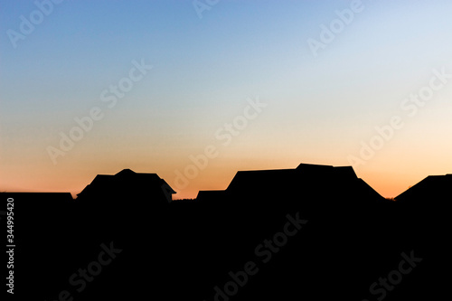 Silhouette of Houses at Sunset