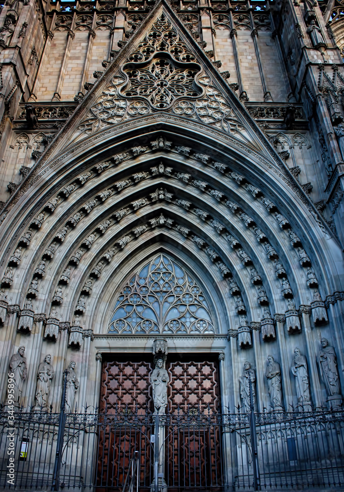 Main gate, facade and entrance of the Gothic Barcelona Cathedral, The Cathedral of the Holy Cross and Saint Eulalia. Barcelona, Catalonia, Spain.