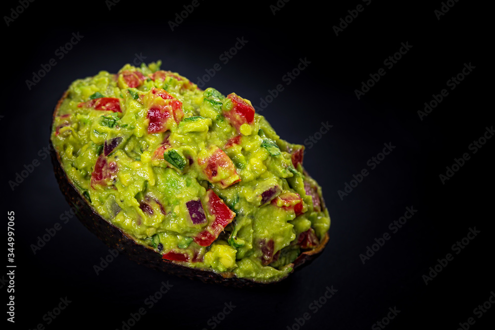 Guacamole Dip in Halves of Avocado Skins on White Wooden Background. Selective focus. Guacamole Dip in Halves of Avocado Skins on White Wooden Background. Selective focus.