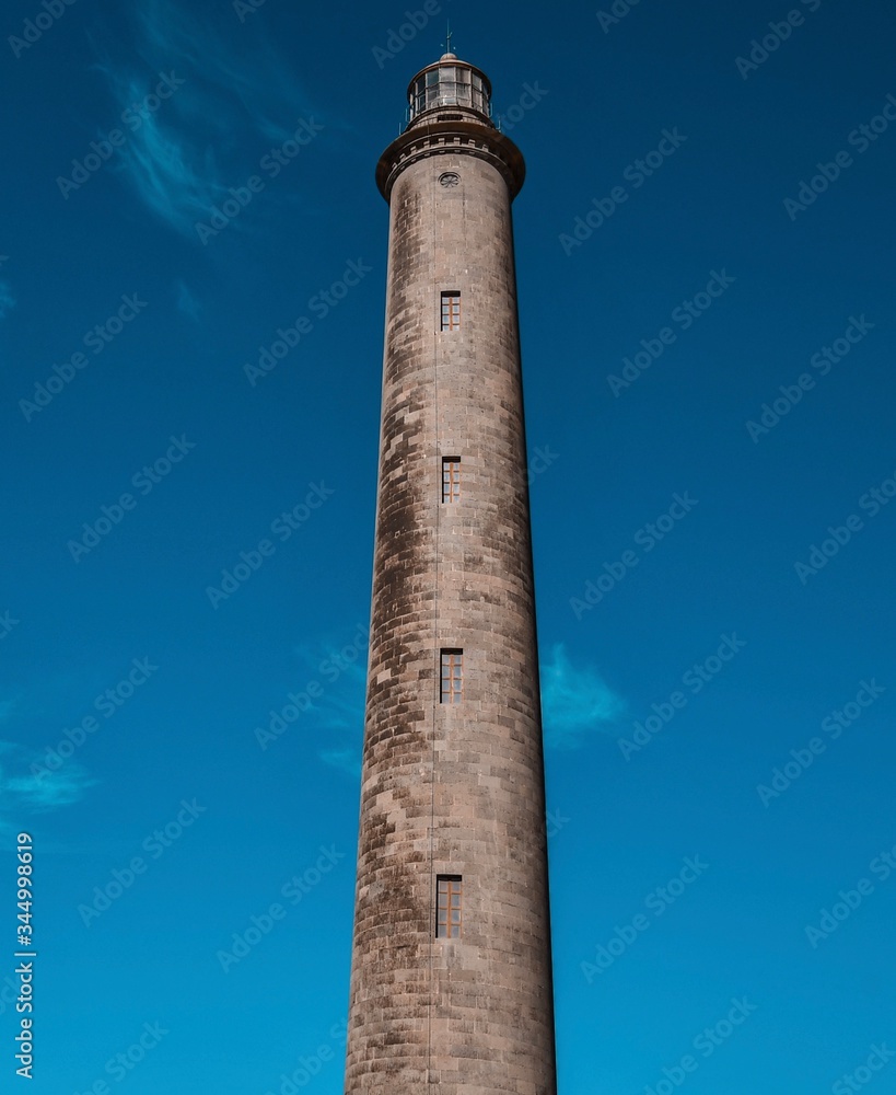 Maspalomas Lighthouse in the blue sky background - Maspalomas, Gran Canaria 12/2019