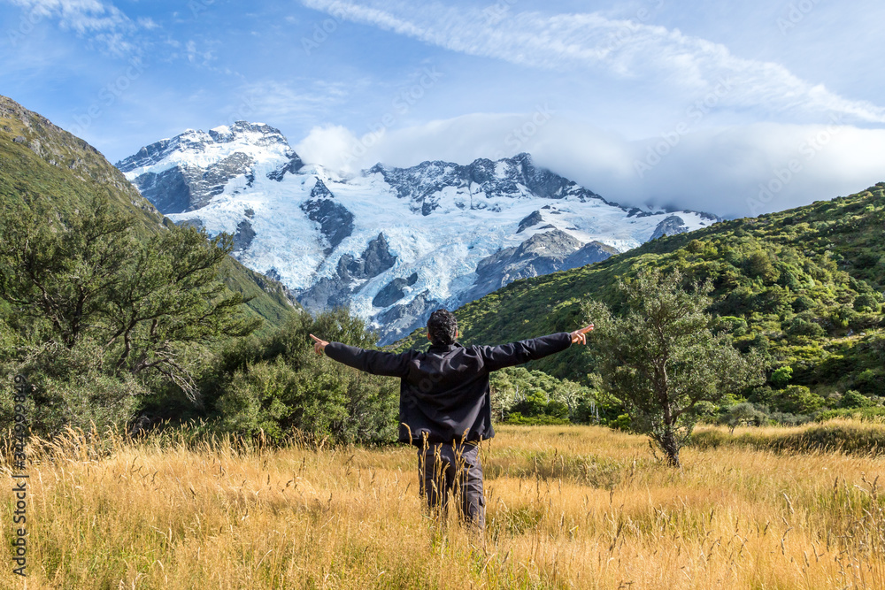 Fototapeta premium Man with open arms during at Mount Cook, New Zealand ..