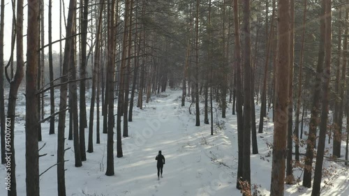 Winter running, running woman, back view