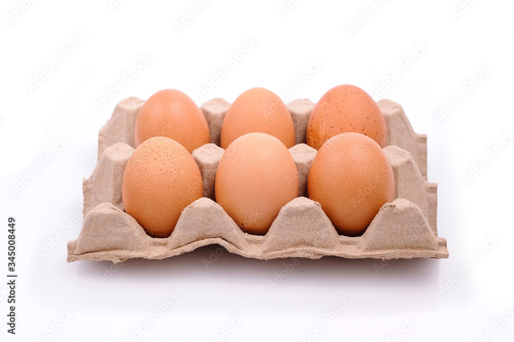 Chicken eggs in box, isolated on white Chicken eggs in box, isolated on white