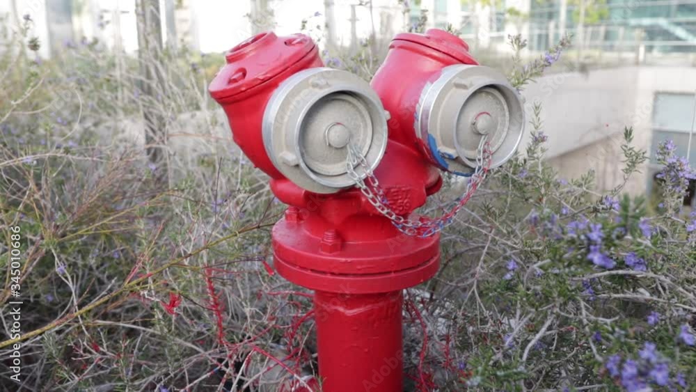 fire hydrant for connecting two fire hoses or a crane in the background of urban buildings
fire hydrant for connecting two fire hoses or a crane in the background of urban buildings