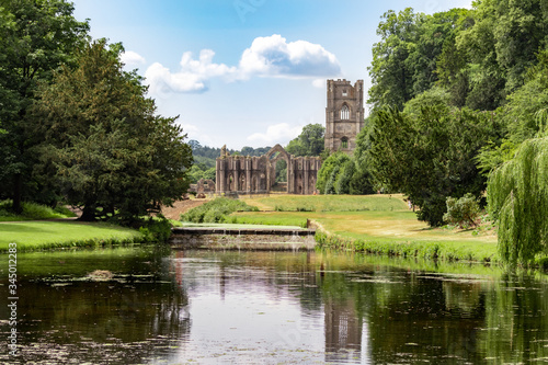 Fountains Abbey and Studley Royal on a warm summer day. photo