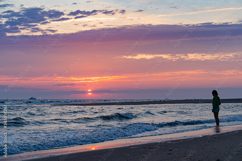 Fototapeta premium Sunset on the beach on north side of the Provincelands Cape Cod, Atlantic ocean view MA US.