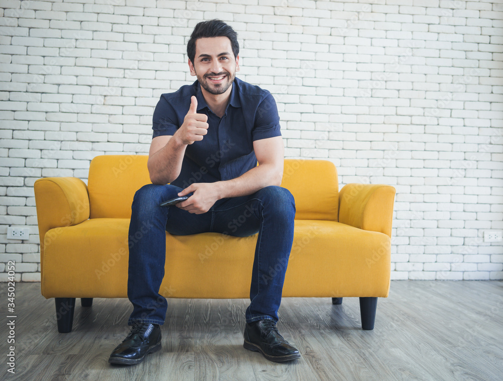 Happy handsome man showing thumbs up Happy handsome man showing thumbs up