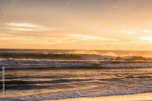 Photography Beautiful shot of people surfing in Santa Monica Beach, Los Angeles, California