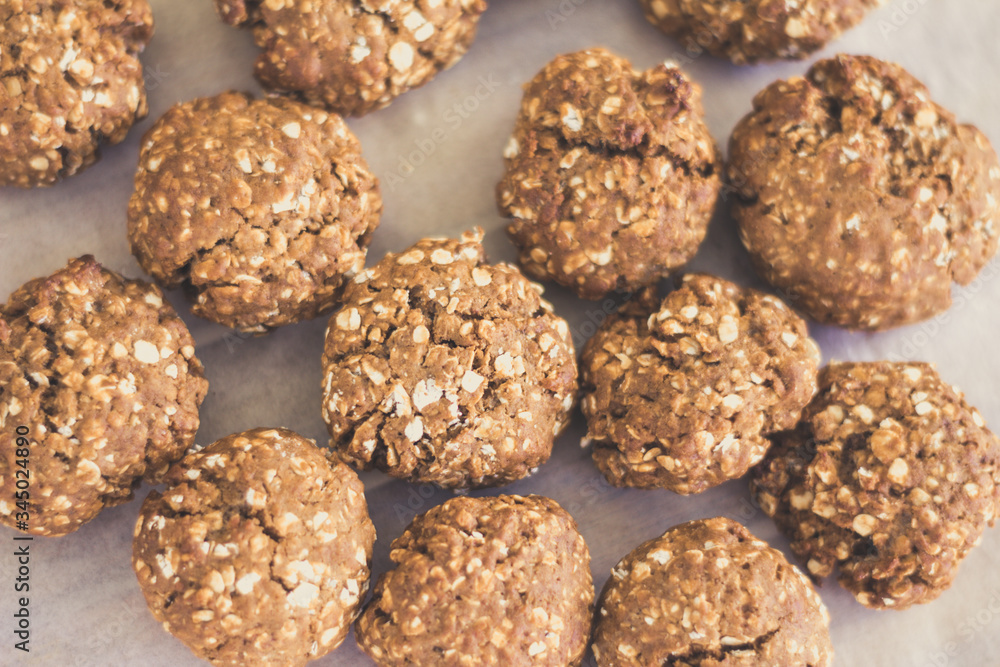topview of homemade oat cookies on bakery paper