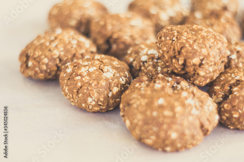 topview of homemade oat cookies on bakery paper