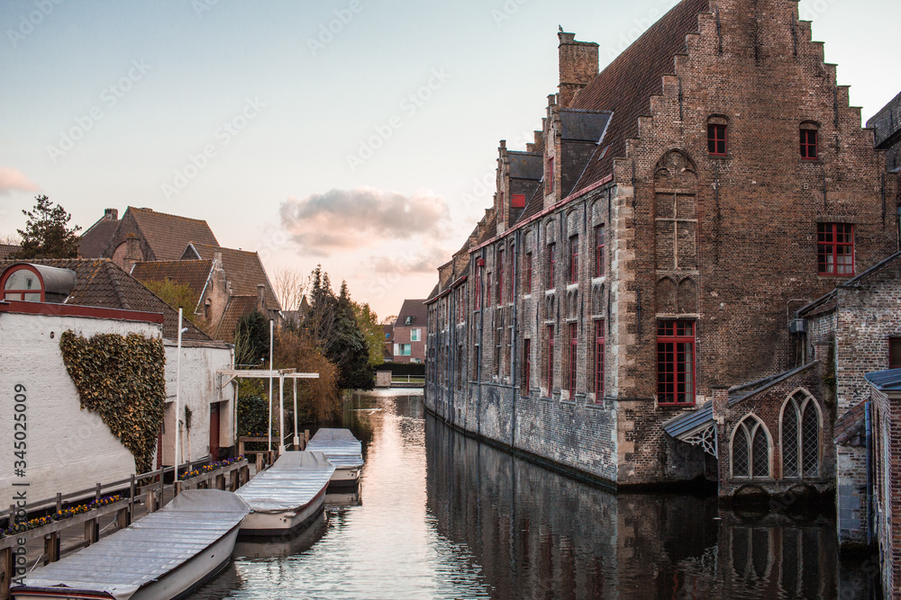 landscape of one of the canals of the city of witches in Belgium. Beautiful sunset