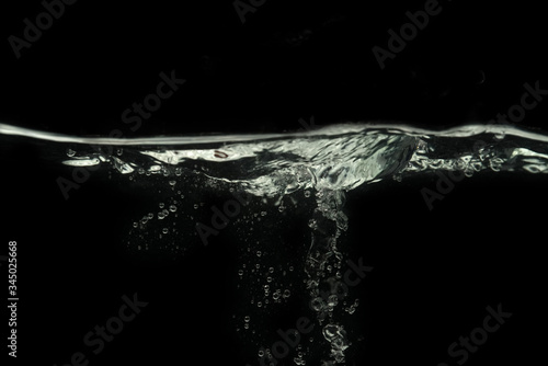 Bubbles on water surface with black background