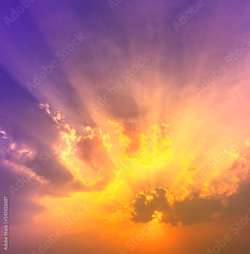 orange sunet light with violet and blue colorful light in dramatic sky with sun beam light