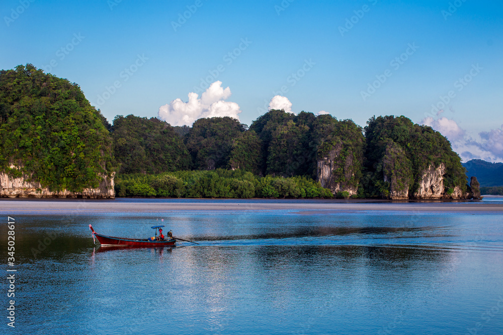 The background of a small fishing boat that is about to dock and there is a blur of water flowing through, being a coexistence of people and nature. The background of a small fishing boat that is about to dock and there is a blur of water flowing through, being a coexistence of people and nature.