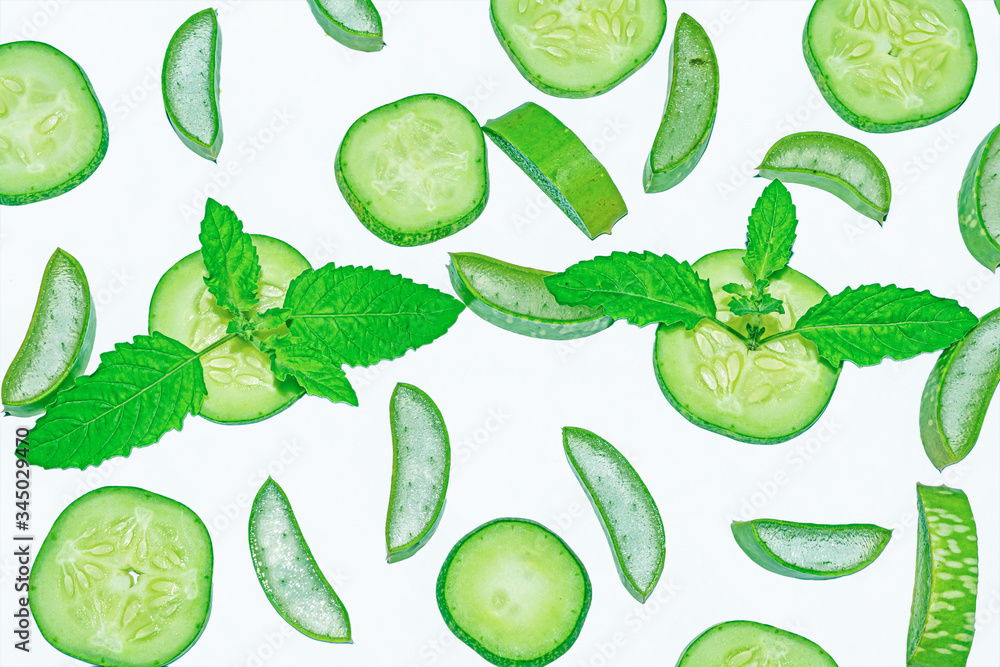 Slices of fresh green aloe vera and cucumber on white background. Slices of fresh green aloe vera and cucumber on white background.