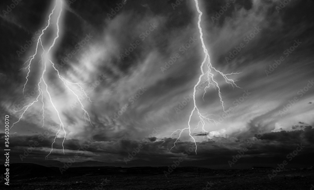 Lightnings during a thunderstorm at night. Black and white image Stock ...