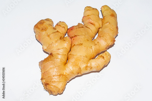 Fresh and young ginger root on white background.