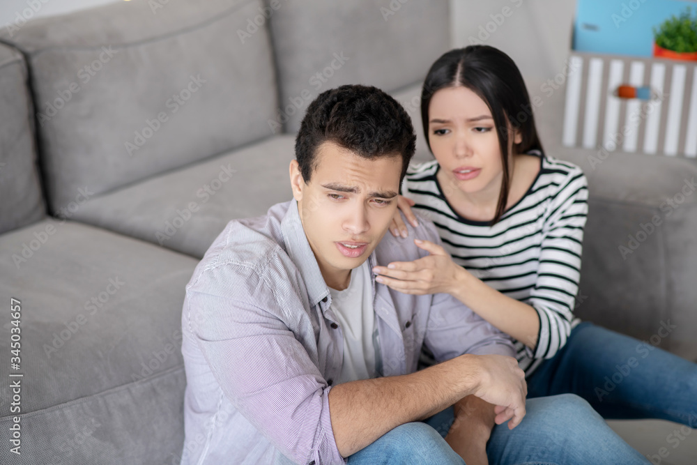 Young couple deciding an important issue together Young couple deciding an important issue together